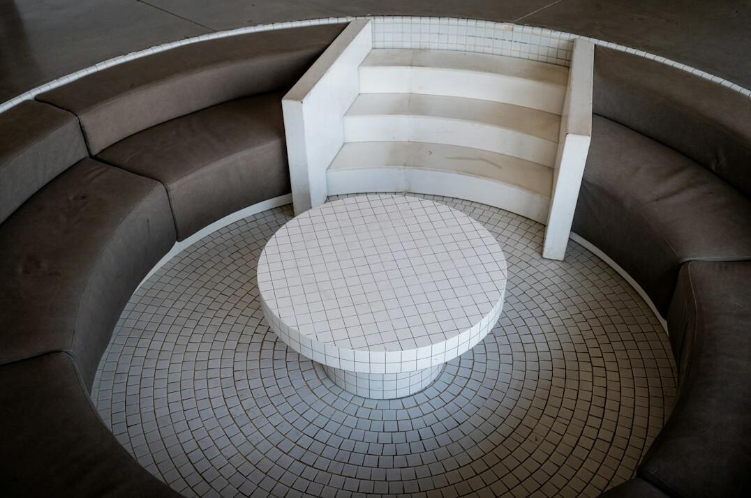 Round table with notepads in a meeting room