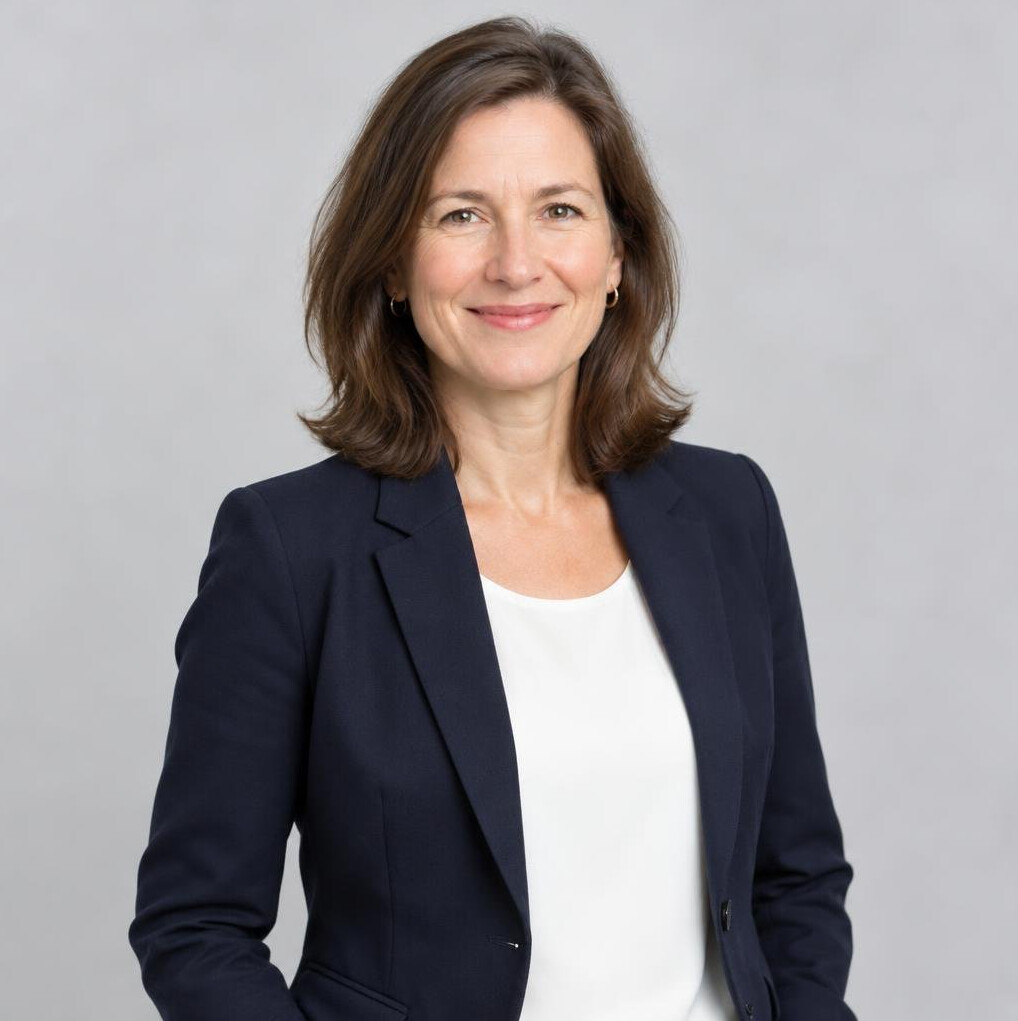 Portrait of a smiling woman researcher with shoulder-length brown hair