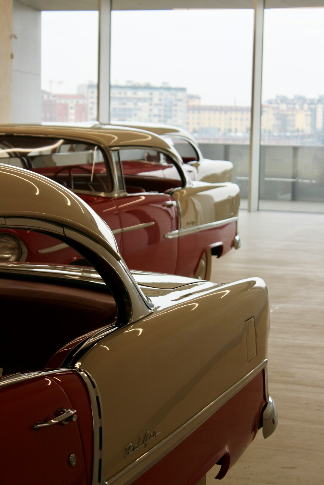 Spacious hall of a private classic car collection with polished floors